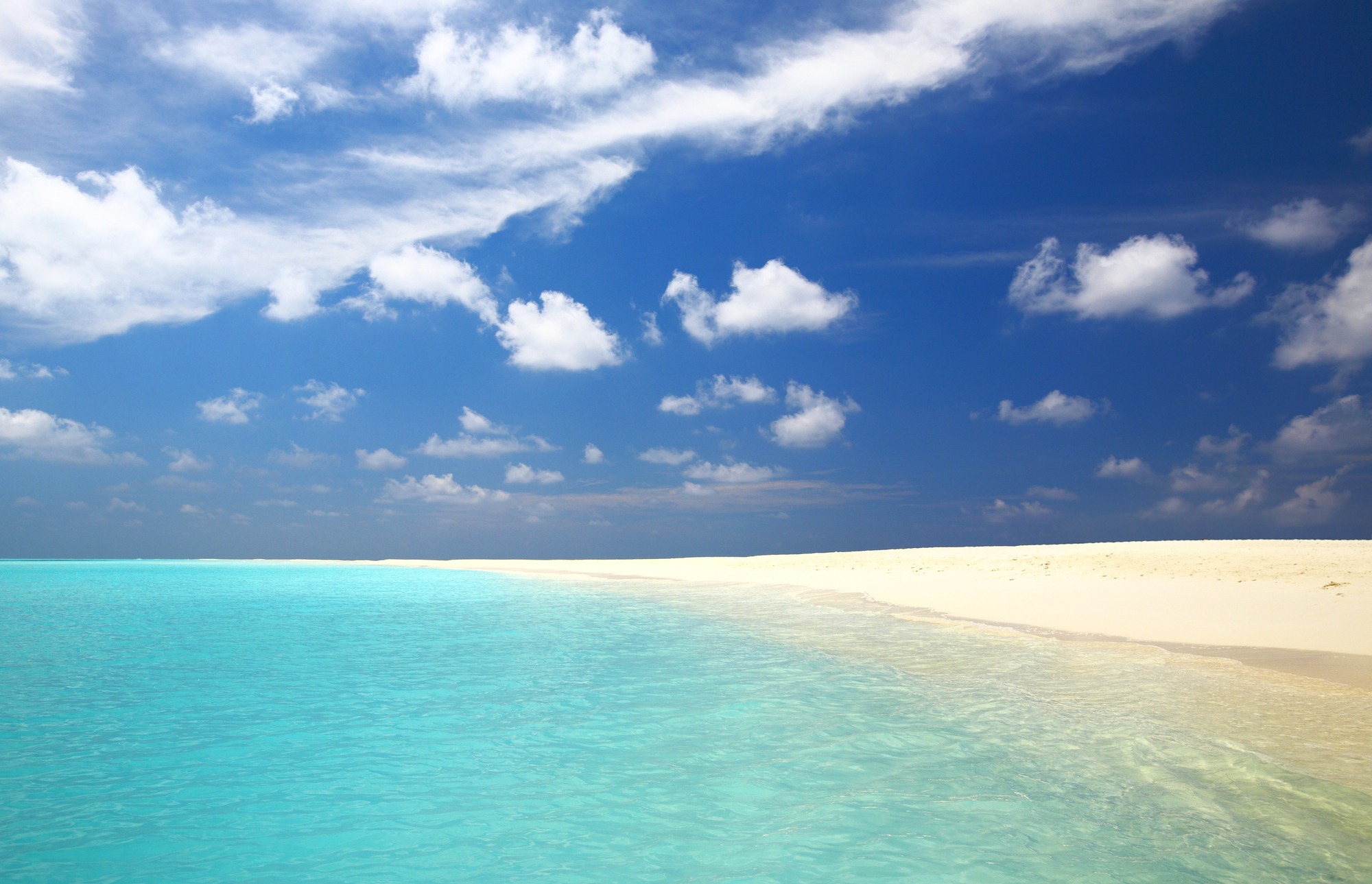 Tropical beach with white sand and clear sea water